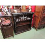 A Victorian carved oak bookshelf