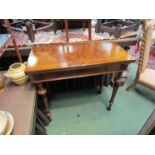An early Victorian burr walnut side table the hinged rectangular top over turned and tapering leg