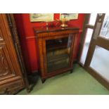 A Victorian inlaid single glazed door pier cabinet on square tapering leg base,