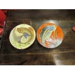 Two mid 20th Century slipware dishes decorated with fish (2)