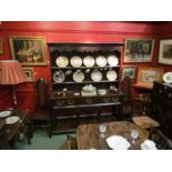 A George II oak dresser and rack, three drawers, a pot board.