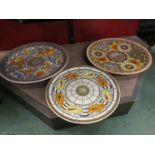 Three Charlotte Rhead by Crown Ducal pottery chargers, floral and foliate design,