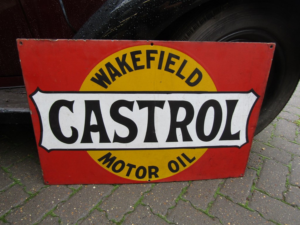 An enamel sign "Wakefield Castrol Motor Oil"