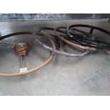 Four assorted vntage car steering wheels including "MG" example