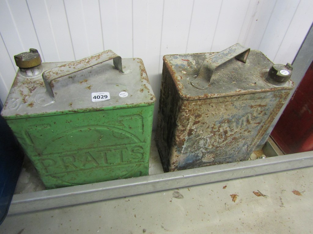 A Pratt's and a Redline fuel cans with caps