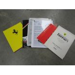 A wallet containing various Ferrari ephemera from Maranello including price guides and fact sheets