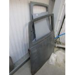 Four vintage car doors including Austin 7 and an Austin 7 boot lid