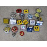 A tray of badges including RAC,