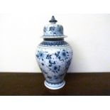 A Delft blue and white vase with lid,