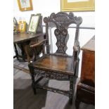 A late 18th Century oak carver chair,