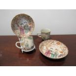Two late 19th Century Chinese tea cups and saucers with hand painted enamel scenes,
