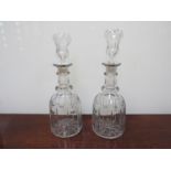 A pair of Victorian facet cut decanters