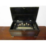 A late 19th Century Swiss music box playing 12 Aires with five bells and butterfly hammers 23cm x