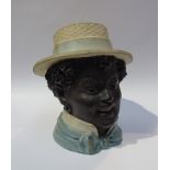 An Edwardian earthenware jar and cover, boy in straw boater, 15.