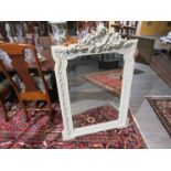 An ornate French over mantel mirror 121cm x 81cm,