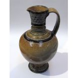 A Martin Brothers stoneware jug, decorated neck and foot, base inscribed London Southall,