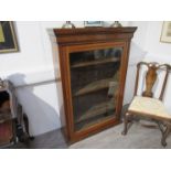 A late Victorian oak glazed single door bookcase,