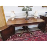 A Regency mahogany centre table with quatraform reeded and scroll base, single drawer,