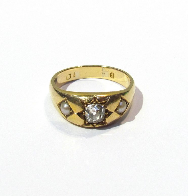 A gypsy ring the centre diamond approximately .