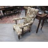 A 19th Century armchair with bobbin turned arms, classic upholstery,