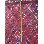 A Chinese malacca walking stick with silver top,