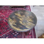 A circa 1900 lacquered Oriental coffee table of circular form,