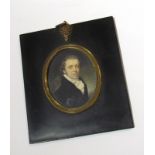 A 19th Century portrait miniature on ivory of handsome gentleman wearing a lace ruff and black coat,