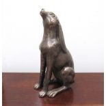 A large resin bronze hare moongazing.