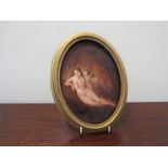 In the manner of Doyle - An oval oil on board of a female nude with cherub,