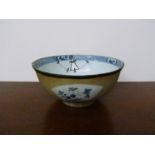 A 19th Century English bowl in the Chinese taste, staple repair,