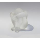 A signed Lalique France clear glass crouching figure,