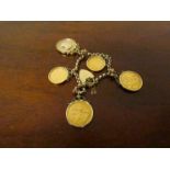 A 9ct gold chain bracelet with two full and two half sovereign charms