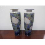 A pair of large Royal Doulton rose decorated vases,