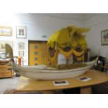 A model of a Venetian gondola, white and enriched with gilt,
