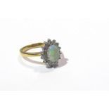 An 18ct gold diamond and opal ring