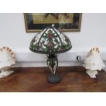 A Tiffany style table lamp with cabochon and floral detail,