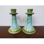 A pair of early 20th Century Mintons Secessionist candlesticks,