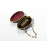 A late Victorian egg form thimble holder with thimble to interior