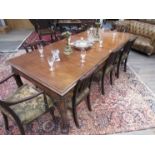 A 19th Century one piece large dining table with tapering legs scroll carved detail,