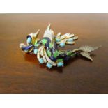 A Jomaz enamelled and paste set brooch as a dragon set with turquoise cabochons