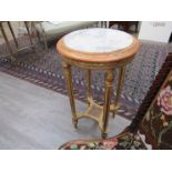 A Continental gilt jardiniere stand with marble top,