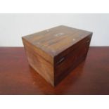 A 19th Century rosewood combined jewellery and writing box with miscellaneous contents,