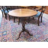 A George III mahogany tripod table with tilt top,