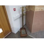 A set of W & T Avery brass doctor's scales, floor-standing,