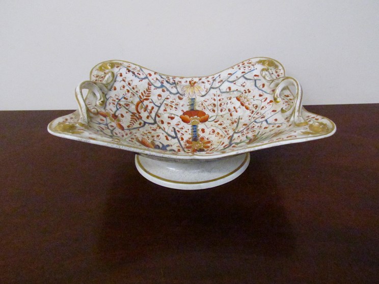 A 19th Century Derby dish with twin handles, pedestal base.