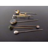 A riding crop brooch and various stick pins (6)