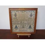 An early 19th Century sampler with verse, trees and decorative border.