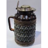 A Doulton lambeth, brown glazed jug with cloverleaf design, monogrammed C.