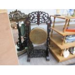 An oriental gong with ornate pierced stand with beaters 120cm tall