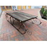 A Victorian cast iron sleigh base with later top a/f,
